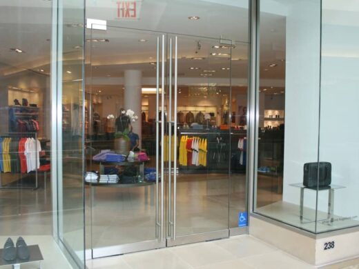 swinging frameless-glass doors